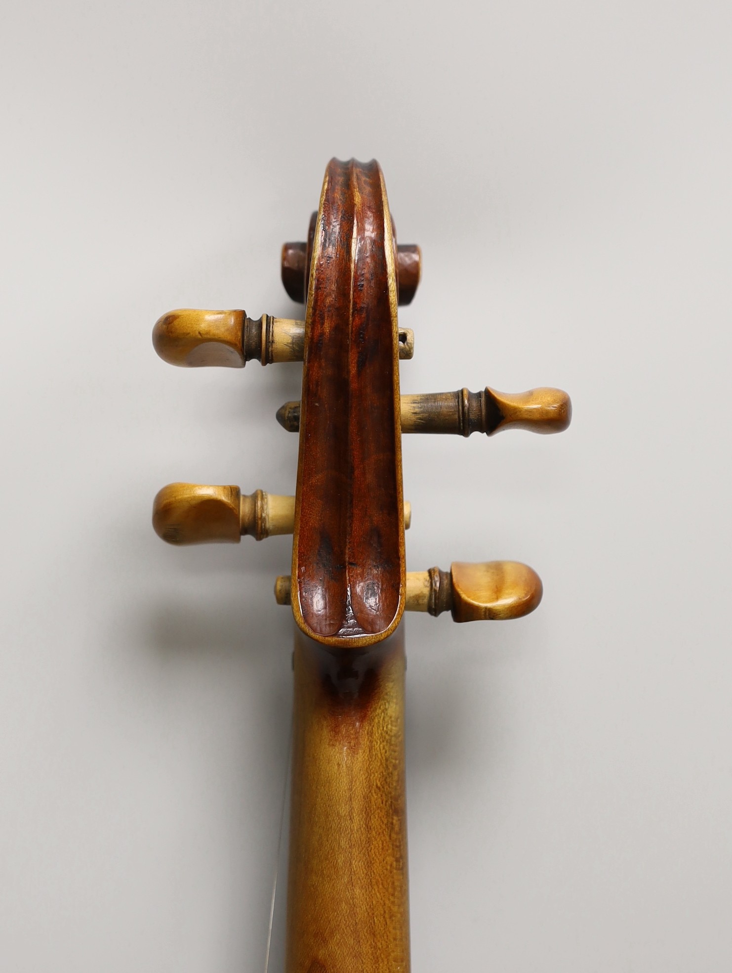 A French single back violin, interior label reads ‘Médio Fino’, back measures 35.5cm excl button. With case and bow